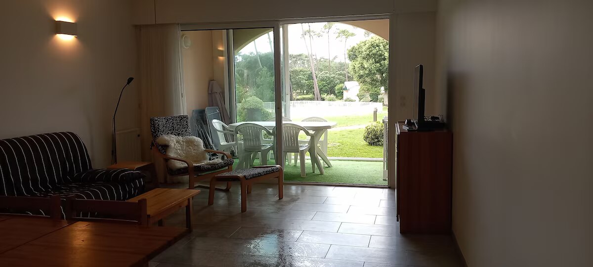 Ground-floor living room opening onto the terrace and private garden area