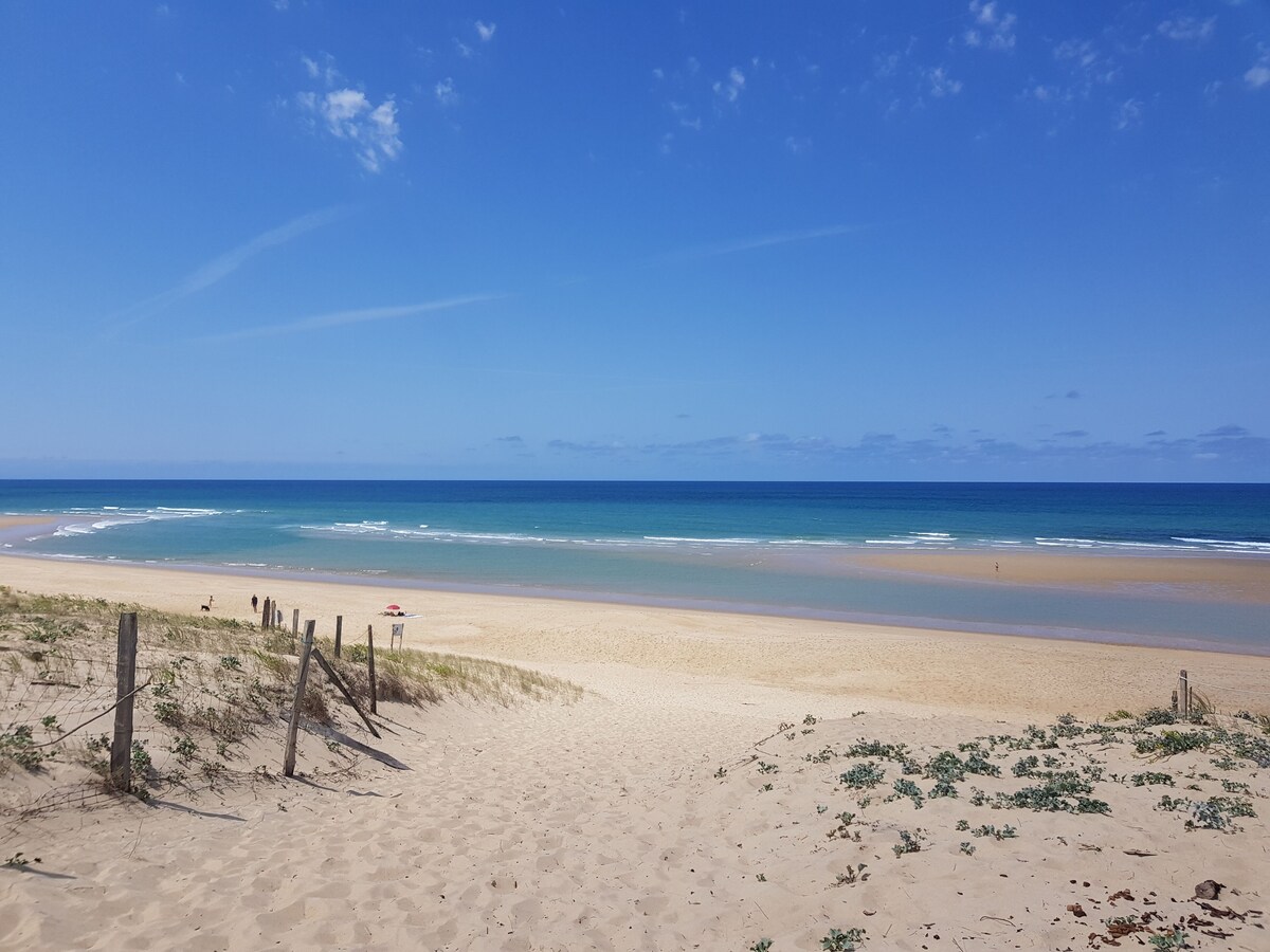 Turquoise Atlantic water and golden sand at the beach of Moliets-et-Maa
